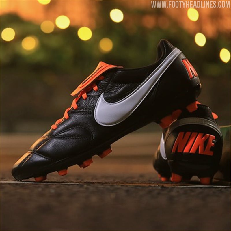 Black and top orange nike boots